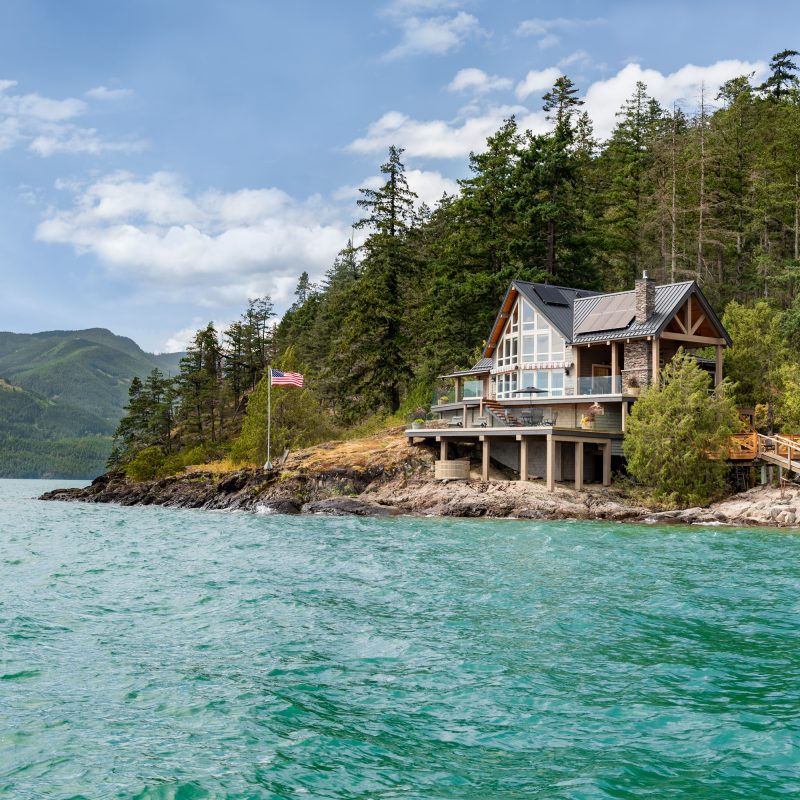 On the point of Cascade Peninsula, the entrance to Cascade Bay on Harrison Lake, B.C., stands a recently remodeled home with exceptional views of the lake and surrounding mountains.